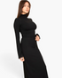 Beach Rose Co. black mock neck crop top with bell sleeves and matching maxi skirt with drawstring waist on a model