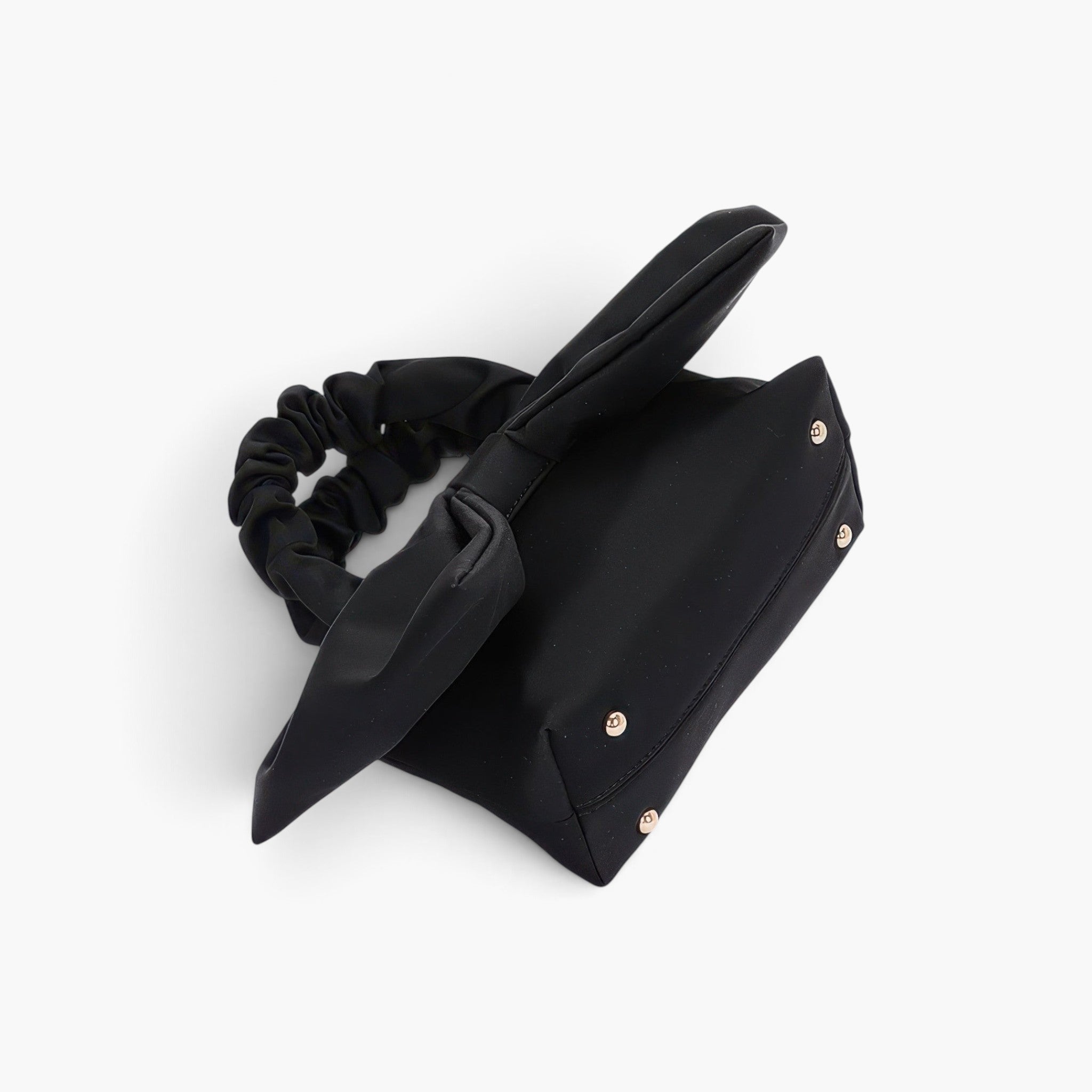 Beach Rose Co. black nylon clutch featuring a decorative bow front and a gathered scrunchie-style top handle.
