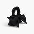 Beach Rose Co. black nylon clutch featuring a large front bow and a gathered scrunchie-style top handle.