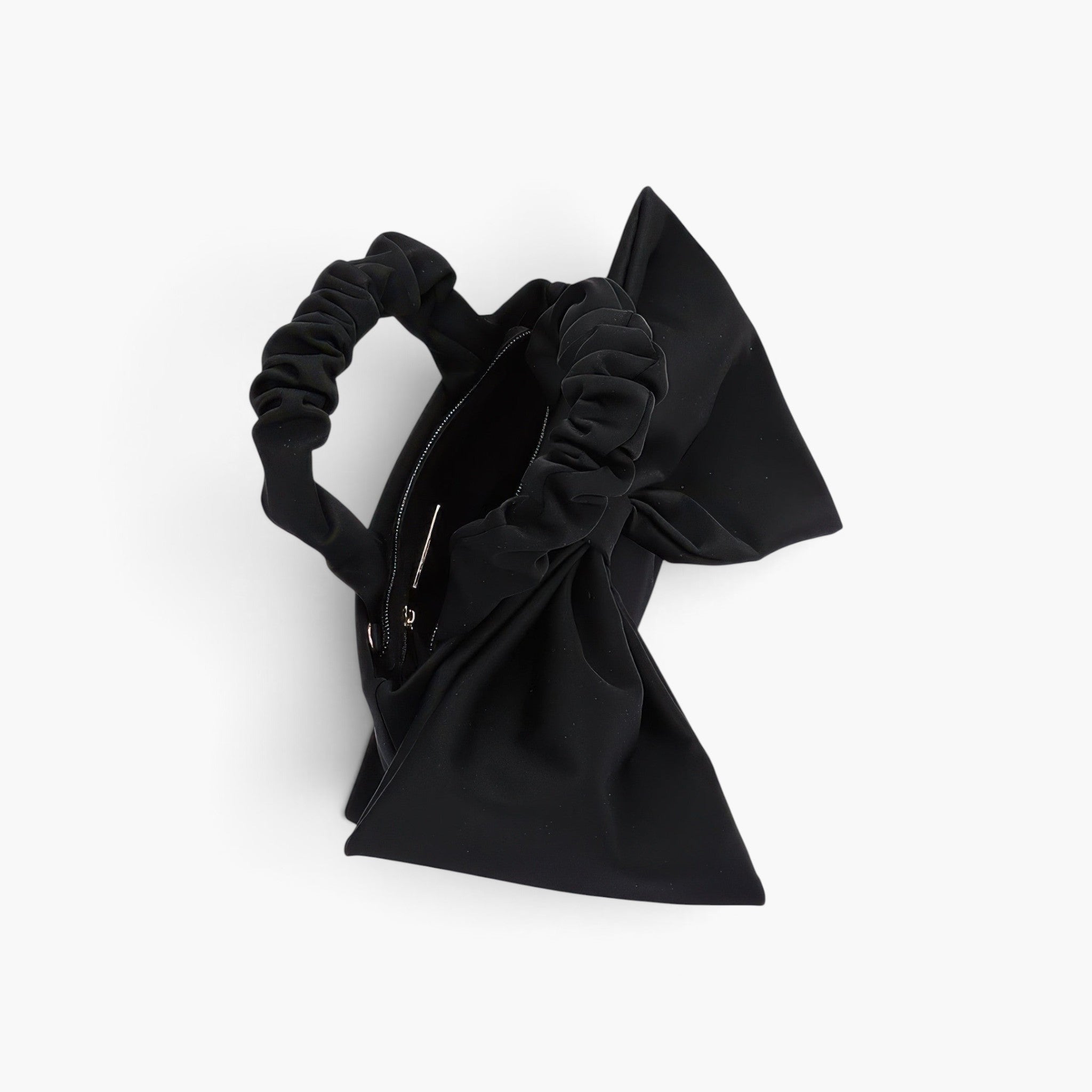 Beach Rose Co. black nylon clutch bag featuring a large front bow and a ruched top handle against a white background