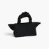 Beach Rose Co. black nylon clutch with a unique bow-inspired front and a gathered scrunchie-style top handle.