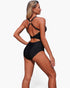 Beach Rose Co. black one-piece swimsuit with a high-waisted silhouette and a stylish U-ring back detail on a model.