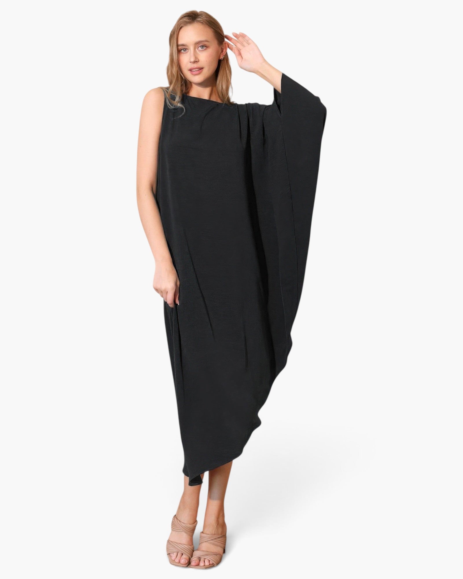 Beach Rose Co. black matte crepe one-sleeve dress worn by a model in a minimalist asymmetrical silhouette