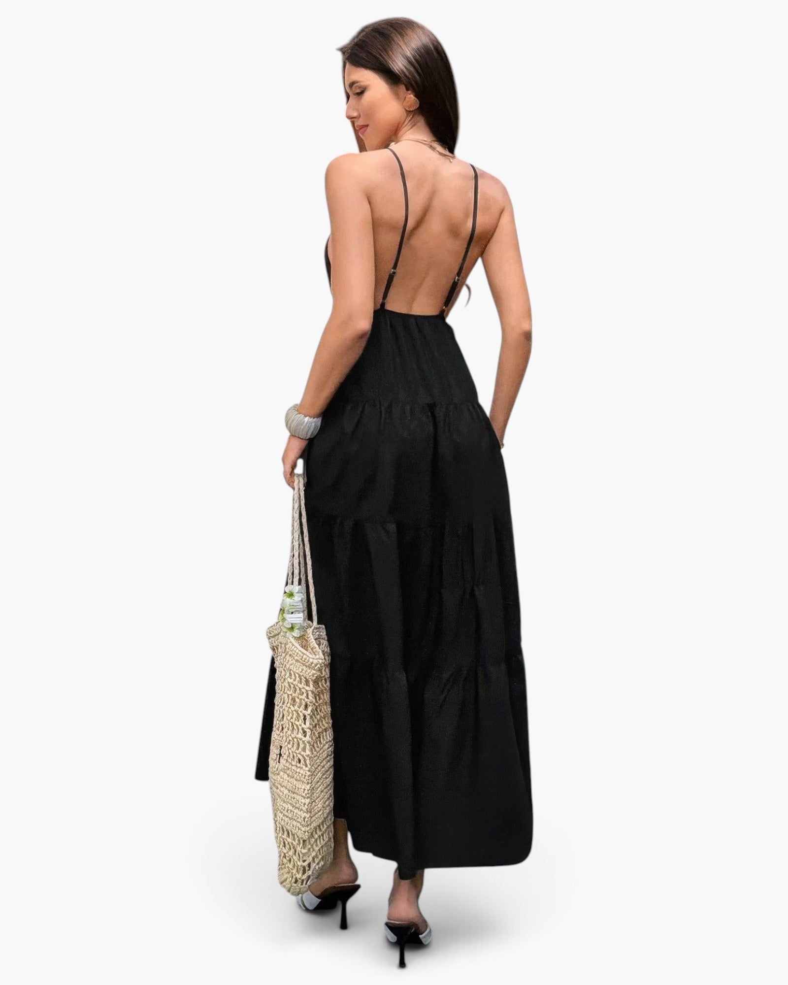Beach Rose Co. black sleeveless maxi dress with an open back, high waist, and tiered skirt, worn by a woman.