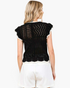 Beach Rose Co. black open-knit top with white contrast trim, ruffled cap sleeves, and a scalloped hem, back view.