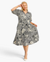 Beach Rose Co. black and ivory cotton midi dress with paisley floral print, collared neckline, and puff sleeves.