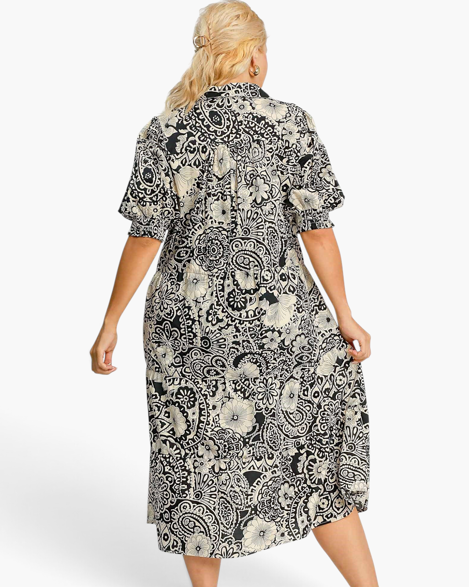 Back view of a Beach Rose Co. black and ivory cotton midi dress with paisley floral print and puff sleeves.