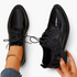 Beach Rose Co. black patent lace-up oxford shoes with a low block heel and stitched panel detailing.