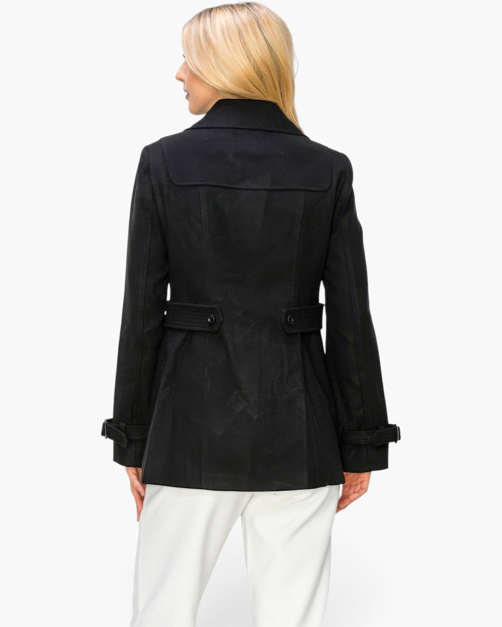 Beach Rose Co. black mid-length peacoat with back button detail worn by a blonde model against a white background
