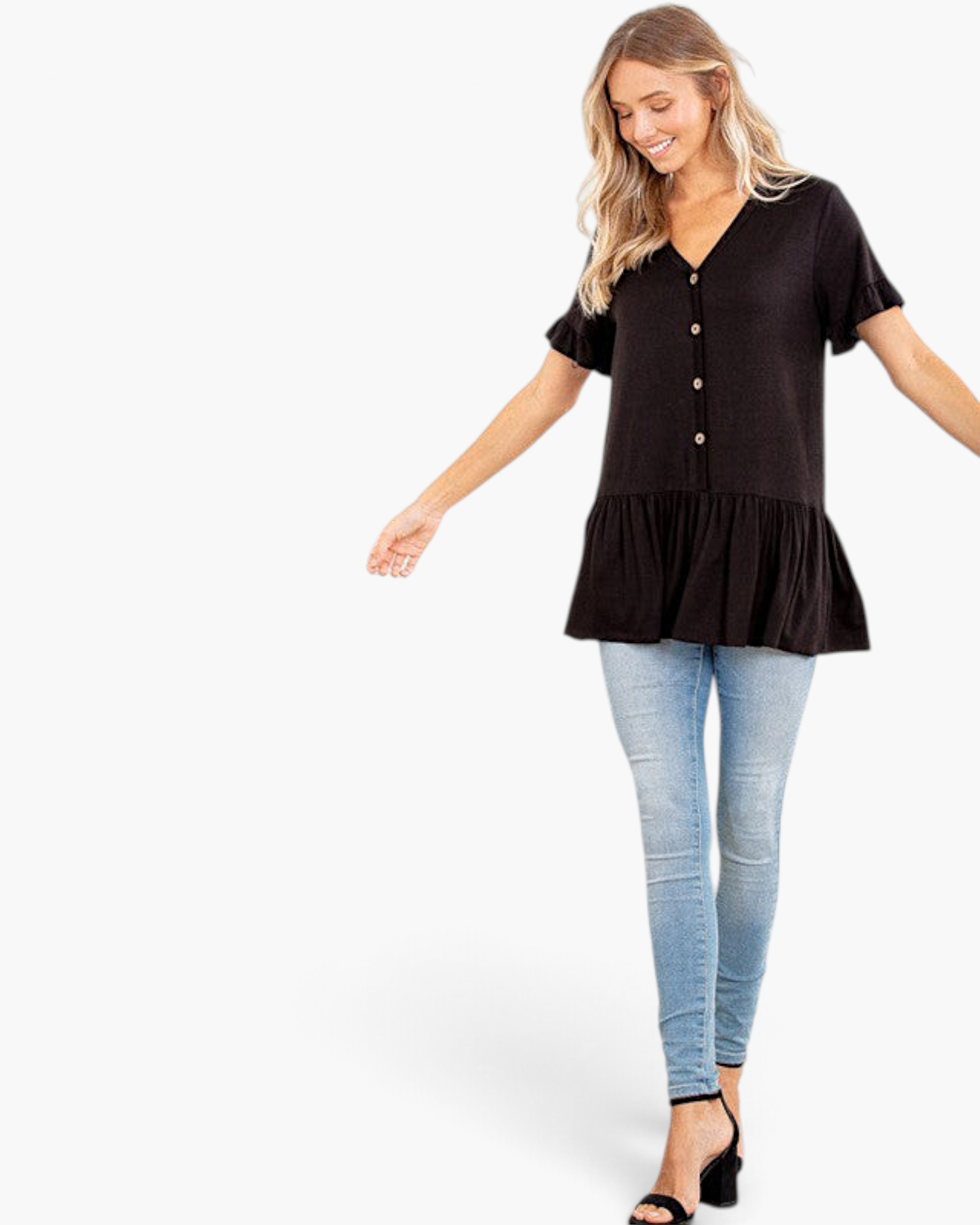 Beach Rose Co. black V-neck peplum top with button front and ruffle sleeves worn by a smiling model with blue jeans.
