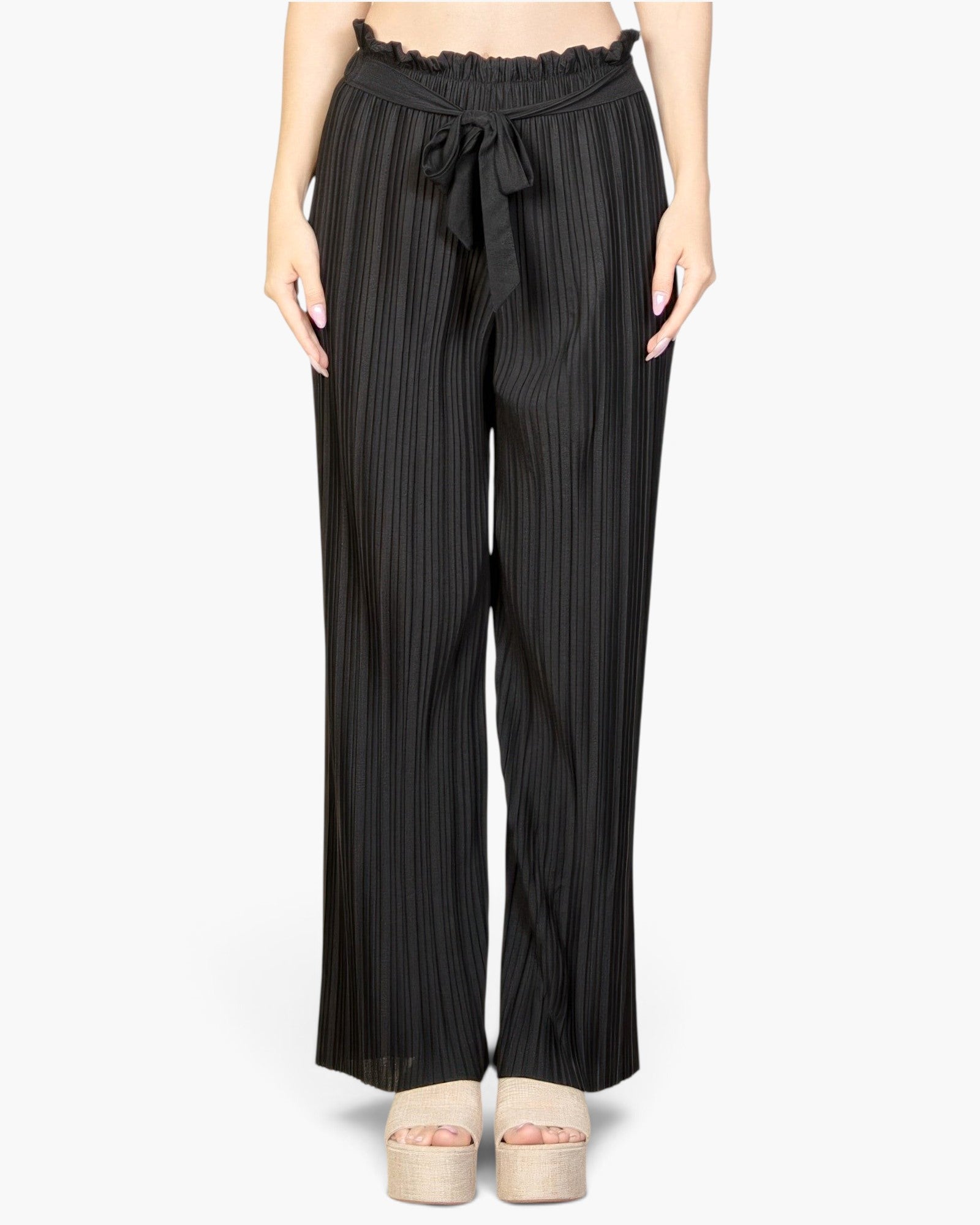 Beach Rose Co. black pleated stretch crepe wide leg pants with a high-waisted tie front design on a model.