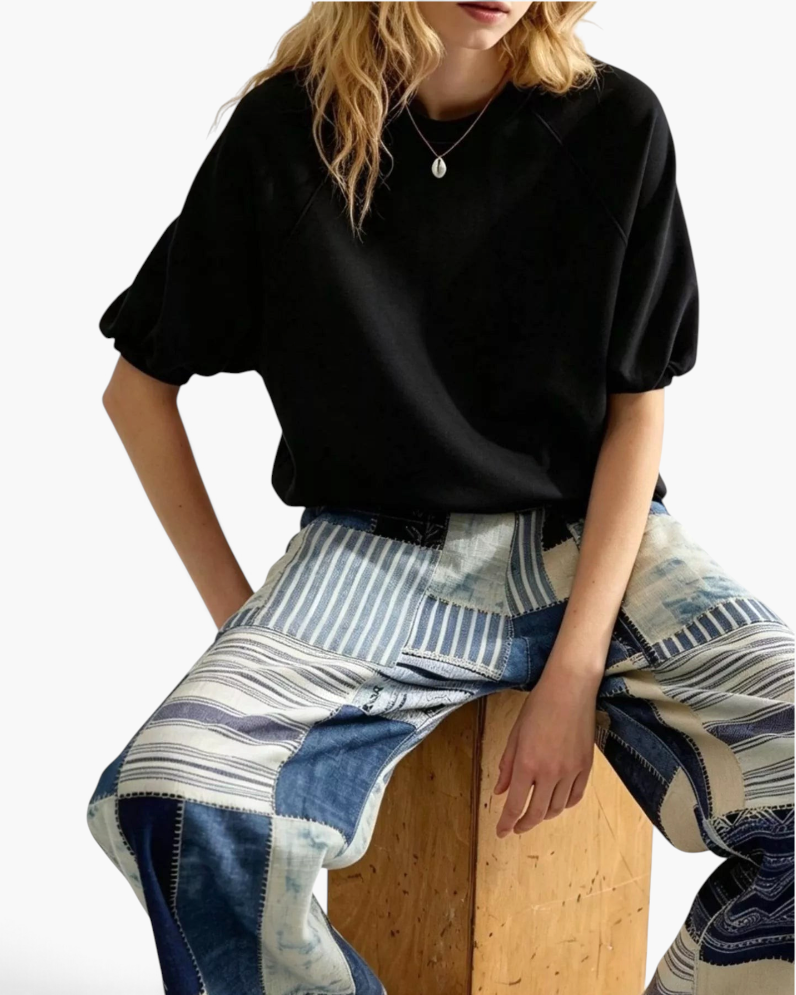 Beach Rose Co. black crewneck sweatshirt with elbow-length puff sleeves and raglan seams worn by a model.