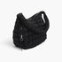 Beach Rose Co. black quilted nylon padded crossbody bag with a soft texture and adjustable strap.