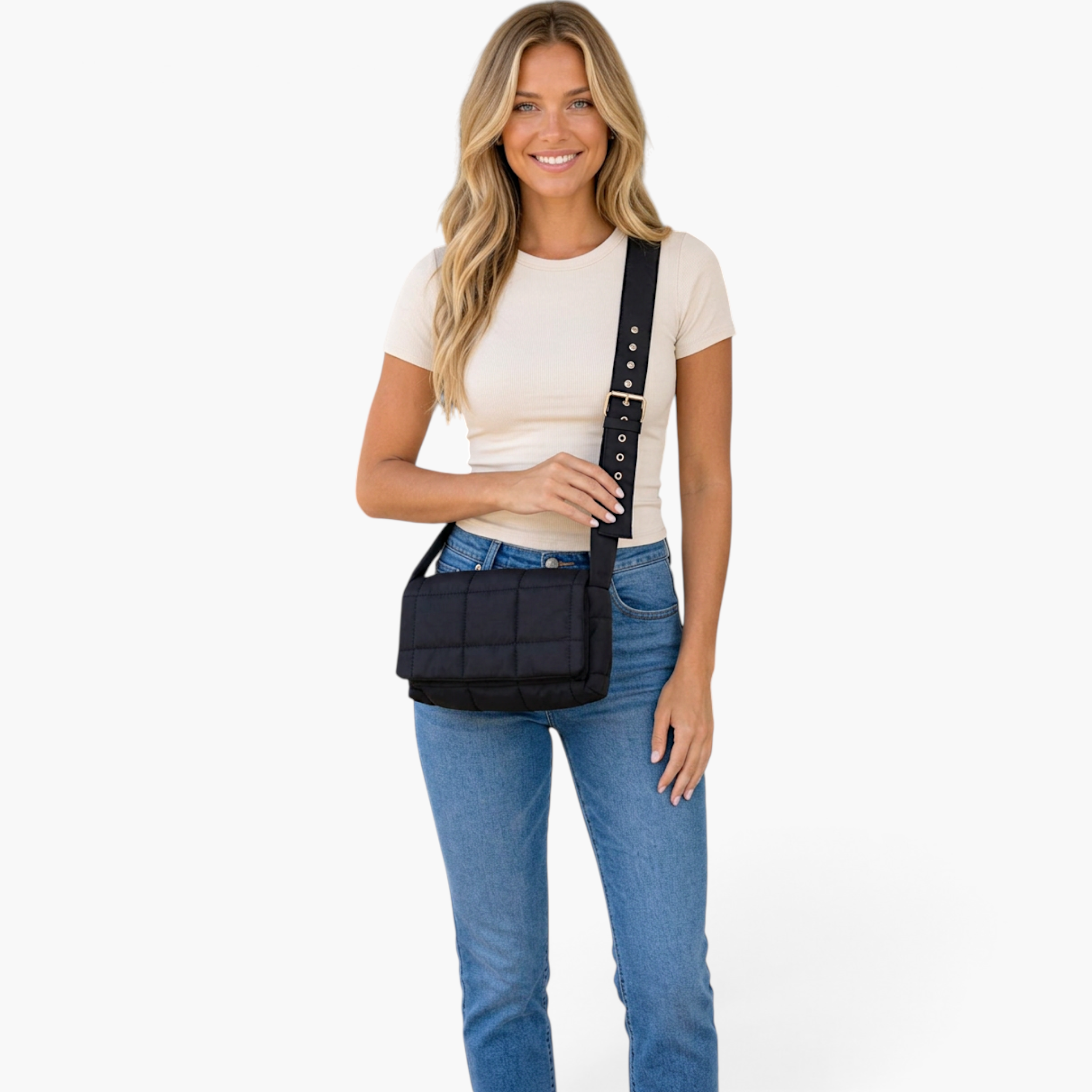 Beach Rose Co. black quilted puffer crossbody bag with gold hardware worn by a blonde model in a beige top and jeans.