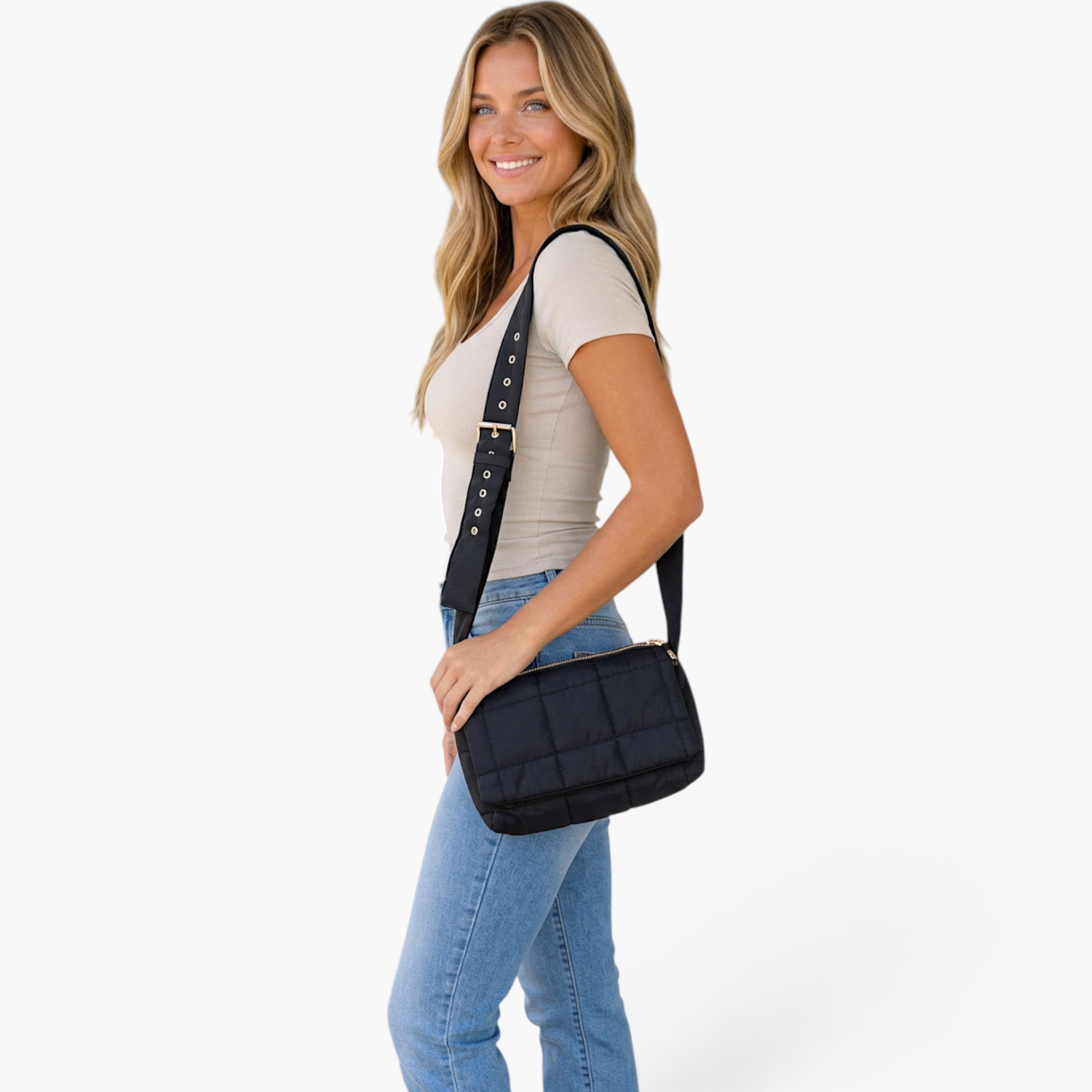 Beach Rose Co. black quilted puffer crossbody bag with gold hardware worn by a smiling woman in a beige top