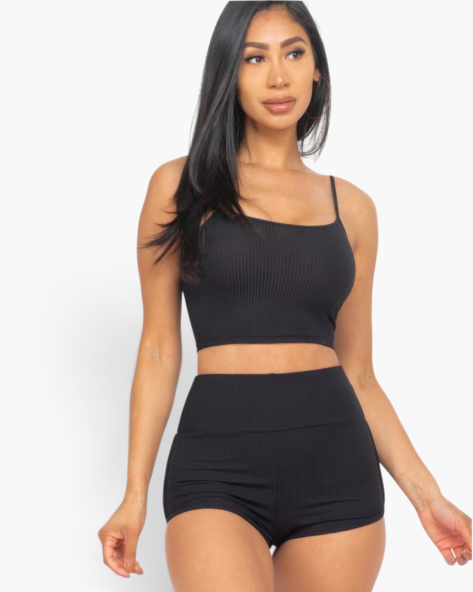 Beach Rose Co. black ribbed cami crop top and matching ruched shorts set worn by a model against a white background.