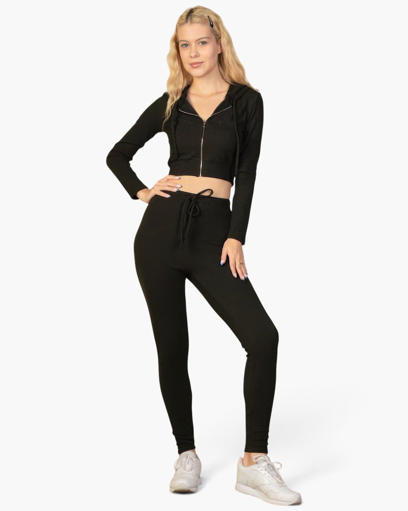 Beach Rose Co. model wearing a black ribbed crop zip hoodie and matching leggings for a stylish casual outfit.