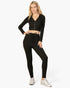 Beach Rose Co. model wearing a black ribbed crop zip hoodie and matching leggings for a stylish casual outfit.