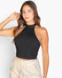 Beach Rose Co. black ribbed halter neck crop top worn by a woman with long brown hair against a white background