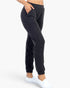 Beach Rose Co. black ribbed joggers with side pockets and a relaxed fit worn by a model on a white background