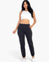 Beach Rose Co. black ribbed side pocket joggers worn by a model with a white crop top against a white background