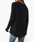 Beach Rose Co. black long sleeve ribbed knit top with a curved hem viewed from the back