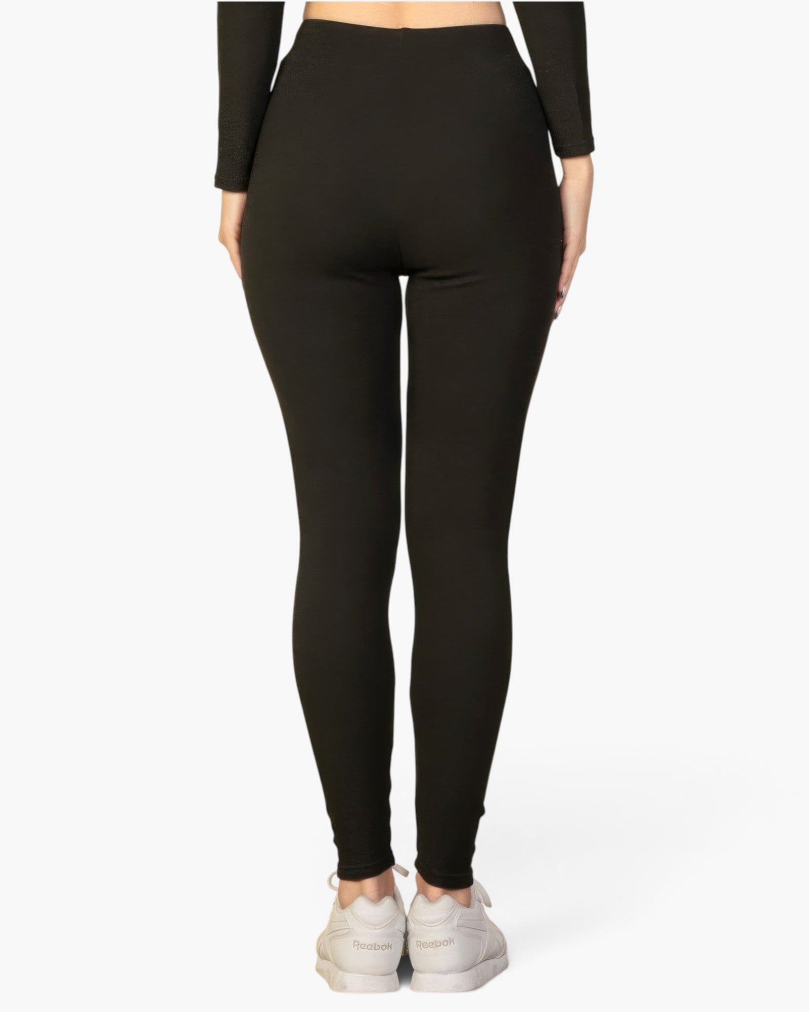 Beach Rose Co. black ribbed lounge leggings on a model, featuring a soft stretch knit fabric and a slim fit.