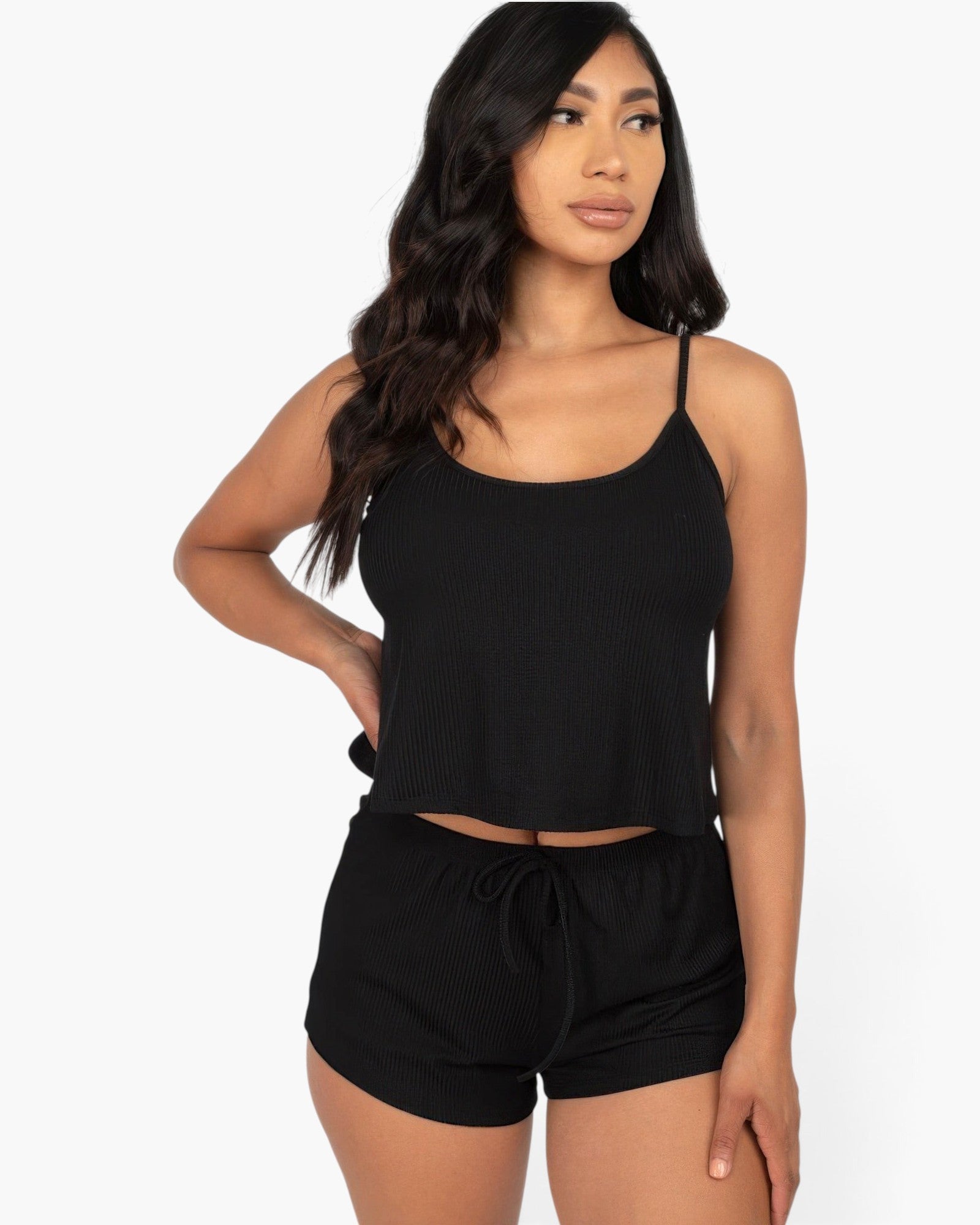 Model wearing a black Beach Rose Co. ribbed strappy top and matching drawstring shorts in soft stretch jersey fabric