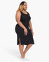 Beach Rose Co. plus size black ribbed tank midi dress with side slits worn by a model with white sneakers