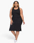 Beach Rose Co. plus size black ribbed tank midi dress with side slits worn by a model with white sneakers