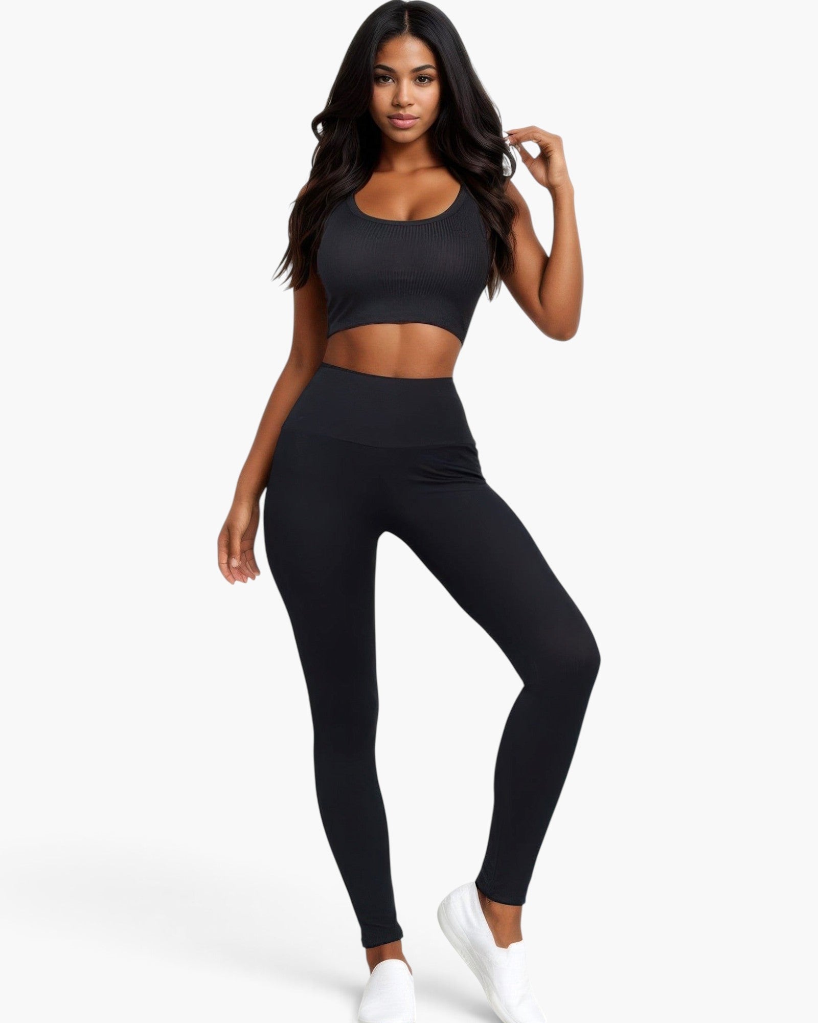 Beach Rose Co. black ribbed crop top and high-waisted leggings set worn by a woman on a white background.
