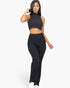 Beach Rose Co. black ribbed mock neck crop tank top and matching bootcut pants worn by a model