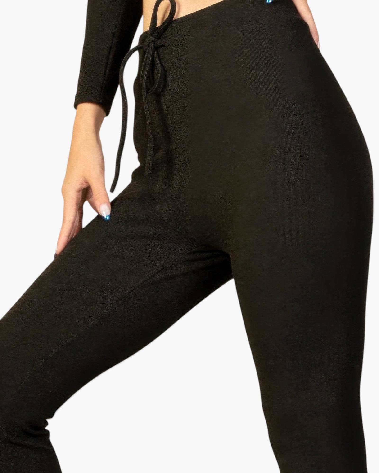 Beach Rose Co. black ribbed lounge leggings with an elastic drawstring tie-front waist on a model