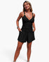 Beach Rose Co. black two-piece bikini with ruched V-neck tank top and matching shorts with pockets on a model