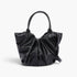 Beach Rose Co. black faux leather tote bag with stylish ruched detailing and sturdy handles on a white background