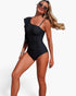 Beach Rose Co. black one-piece swimsuit with an asymmetrical shoulder ruffle and flattering side ruching on a model.