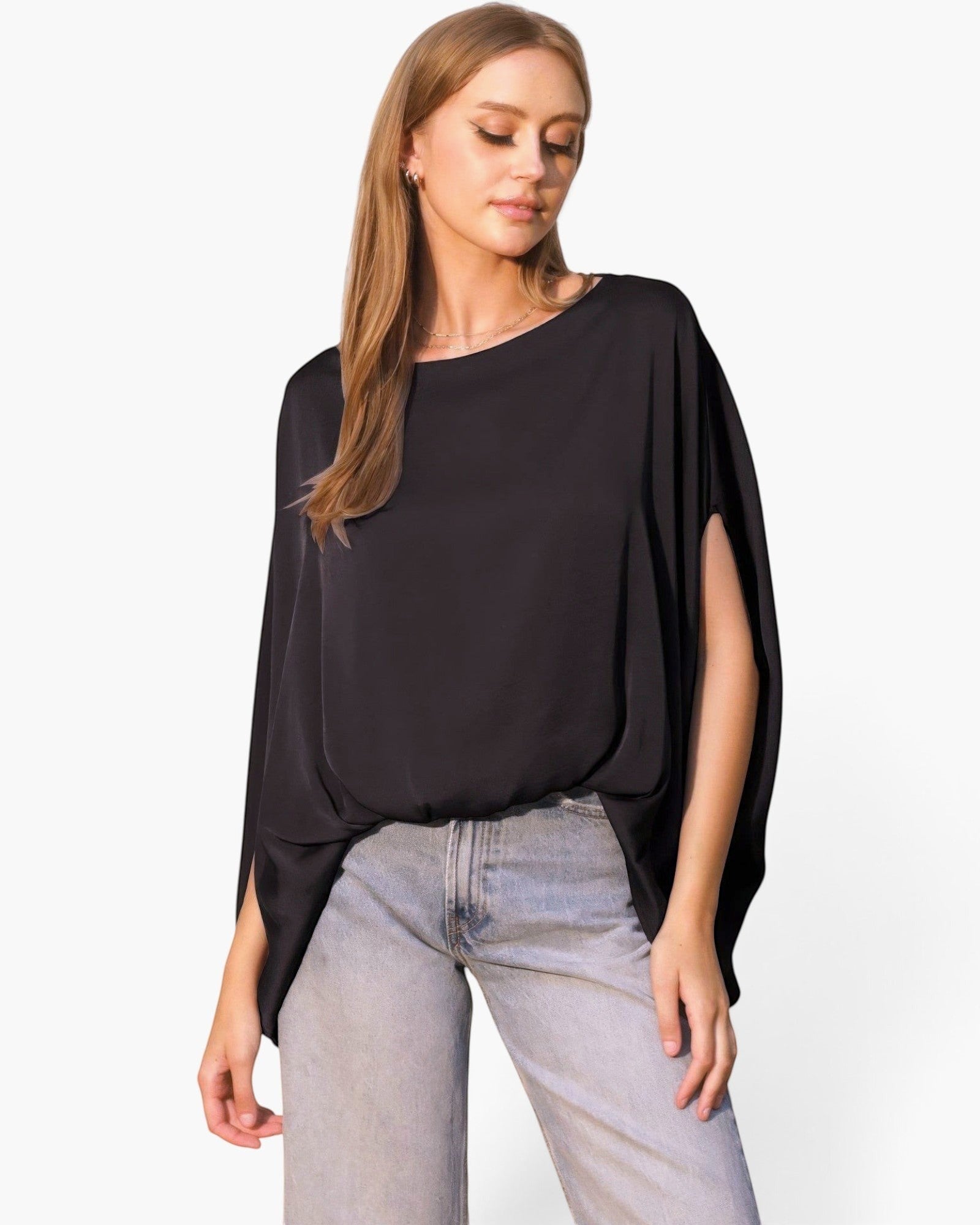 Beach Rose Co. black washed poly silk caftan top with boat neckline and flowy sleeves worn with light wash jeans