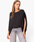Beach Rose Co. black washed poly silk caftan top with boat neckline and flowy sleeves worn with light wash jeans