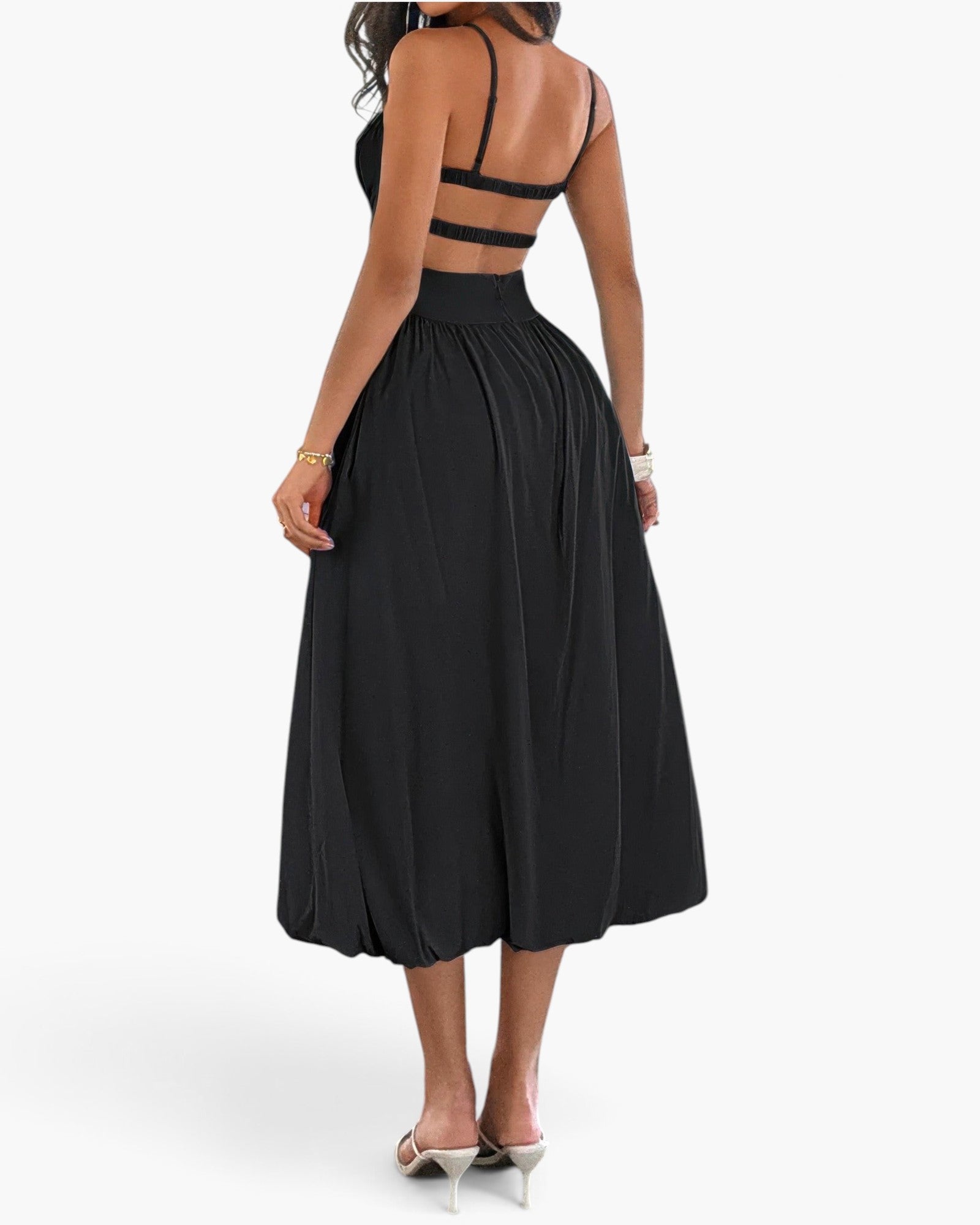 Beach Rose Co. black sleeveless A-line dress with a backless design and ruched bust, worn by a woman from behind.