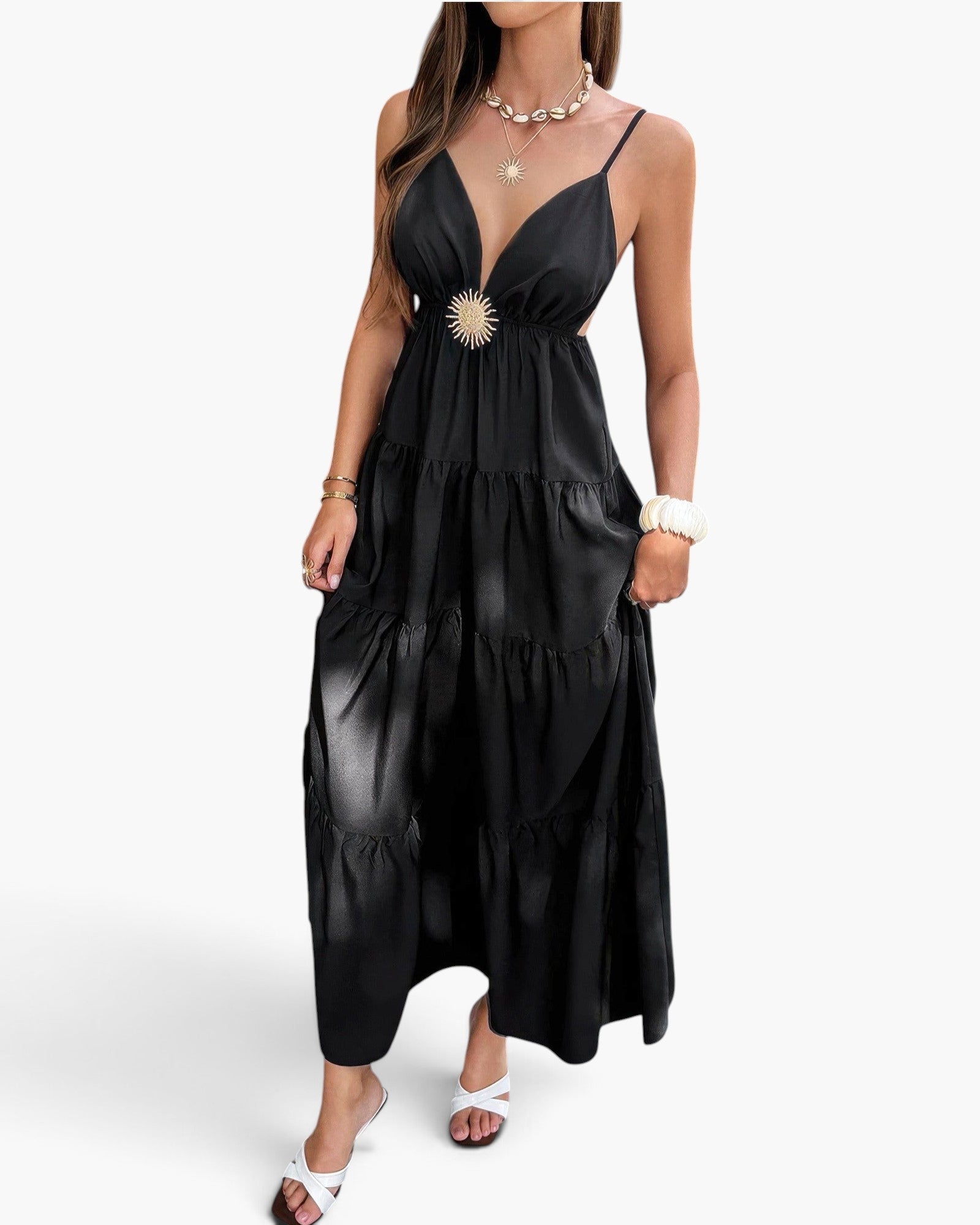Beach Rose Co. black sleeveless maxi dress with a high waist, open back, and tiered skirt, worn with gold jewelry.