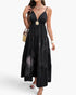 Beach Rose Co. black sleeveless high-waist maxi dress with a tiered skirt and open back detail on a model.