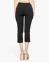 Beach Rose Co. black cropped pants with slit hem detail, worn by a model with platform mules, back view.
