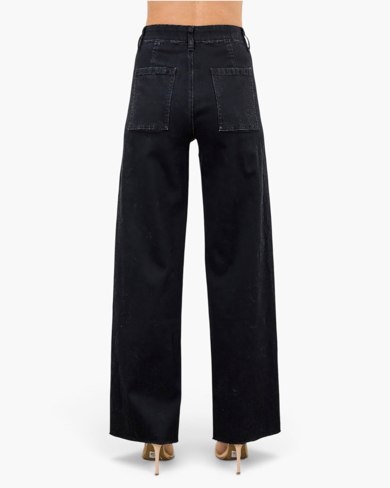 Beach Rose Co. black high-rise straight-leg jeans with back pockets, viewed from behind on a model in heels.