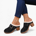 Beach Rose Co. black suede clogs with fluffy trim, oversized buckle, contrast stitching, and chunky block heel.