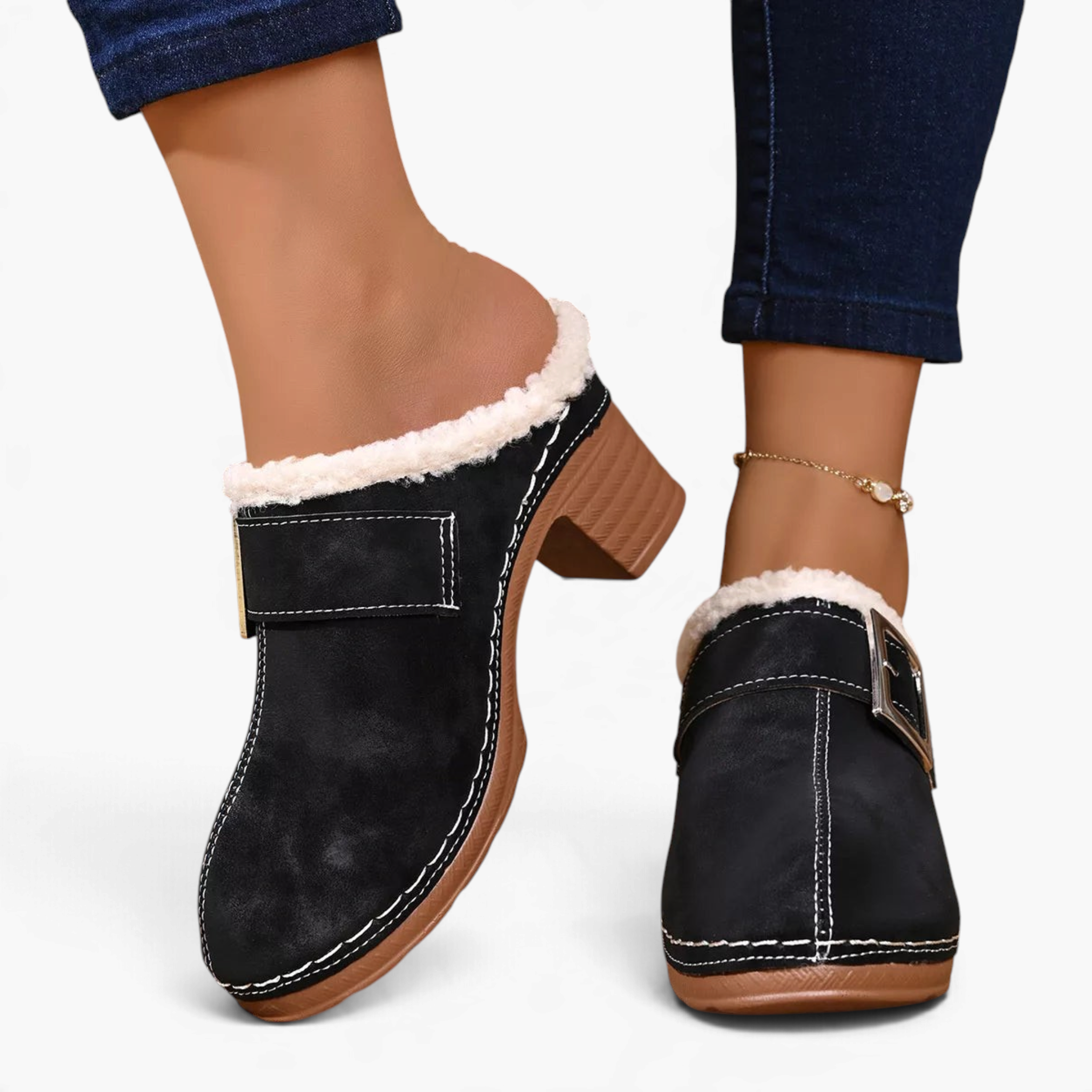 Beach Rose Co. black suede clogs with fluffy white trim, oversized buckle, contrast stitching, and chunky block heel.