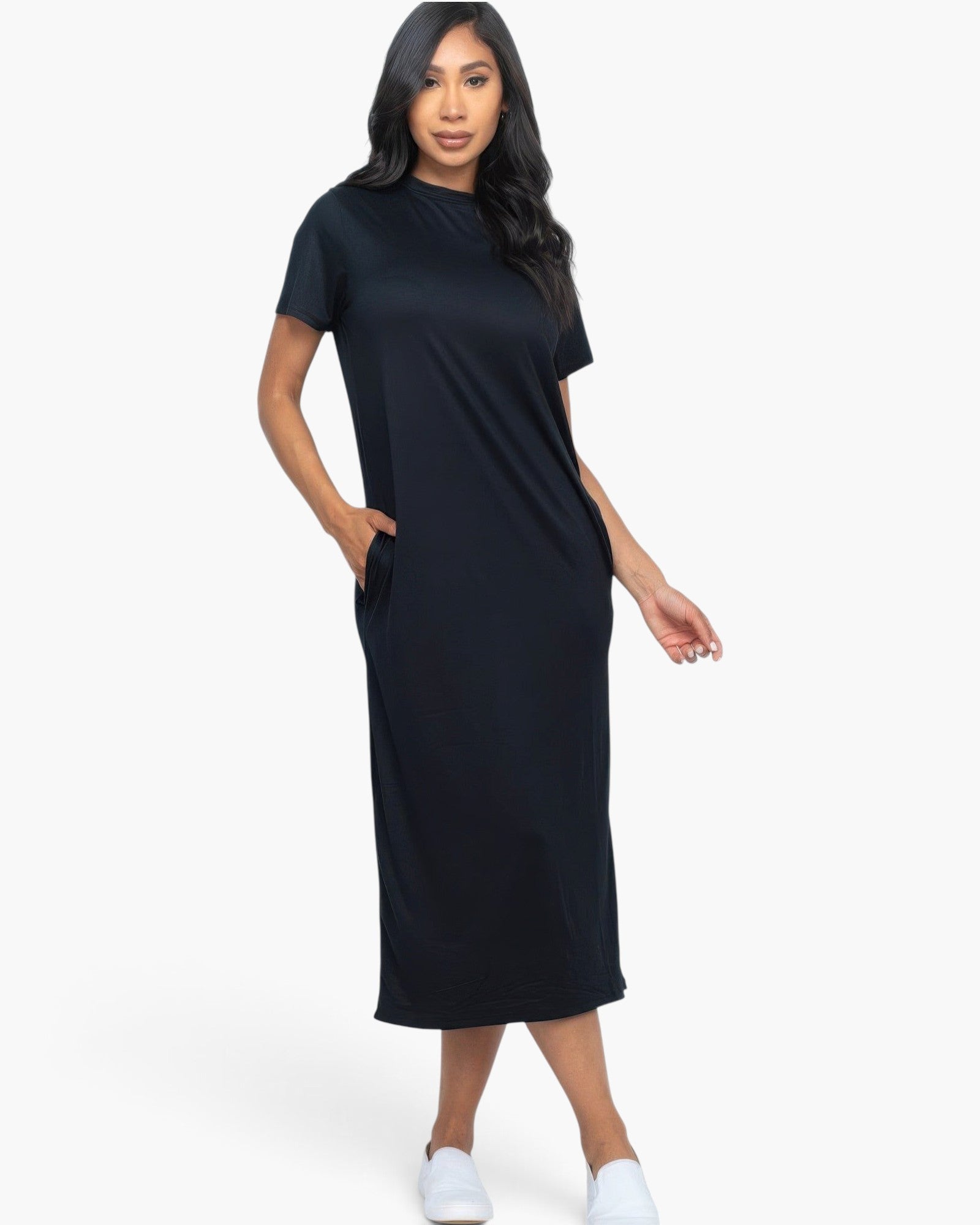 Model wearing a Beach Rose Co. black midi tee dress in soft stretch jersey fabric with convenient side pockets