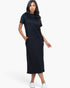 Model wearing a Beach Rose Co. black midi tee dress in soft stretch jersey fabric with convenient side pockets