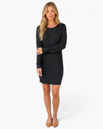 Beach Rose Co. black textured knit sweater dress with a round neckline and long sleeves on a blonde model