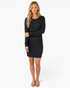 Beach Rose Co. black textured knit sweater dress with a round neckline and long sleeves on a blonde model