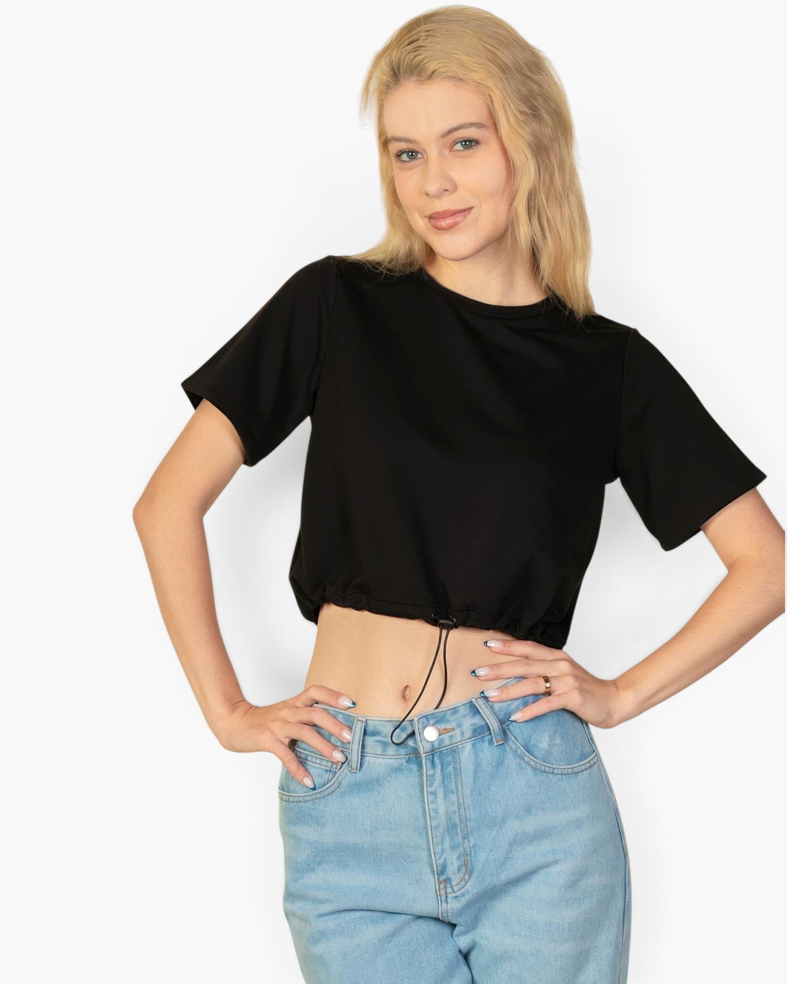 Beach Rose Co. black French Terry crop top with an adjustable toggle drawstring hem worn by a blonde model